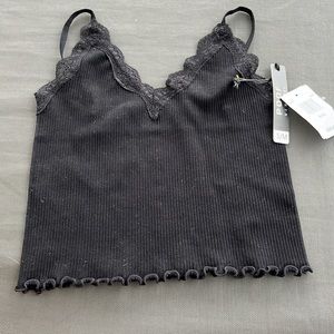 Black crop top that is size small. This is from the brand Poof New York.